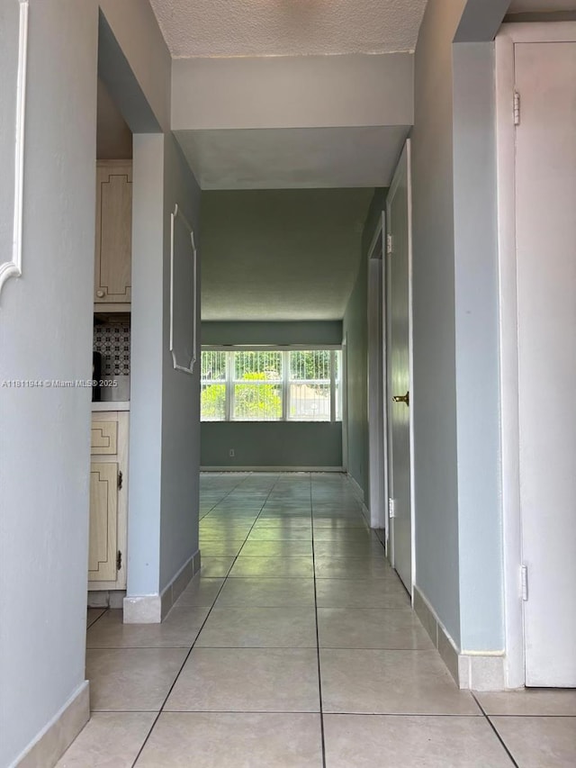 1333 E Hallandale Beach Blvd Unit 134, Hallandale Beach, FL 33009 - hall featuring light tile patterned flooring and baseboards