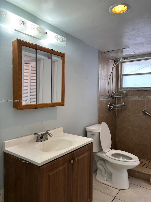 1333 E Hallandale Beach Blvd Unit 134, Hallandale Beach, FL 33009 - full bathroom featuring toilet, vanity, a shower stall, and tile patterned flooring
