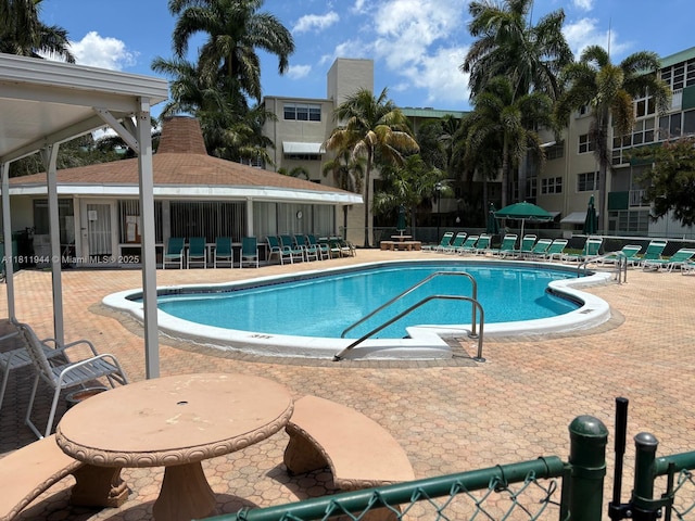 1333 E Hallandale Beach Blvd Unit 134, Hallandale Beach, FL 33009 - community pool featuring a patio area