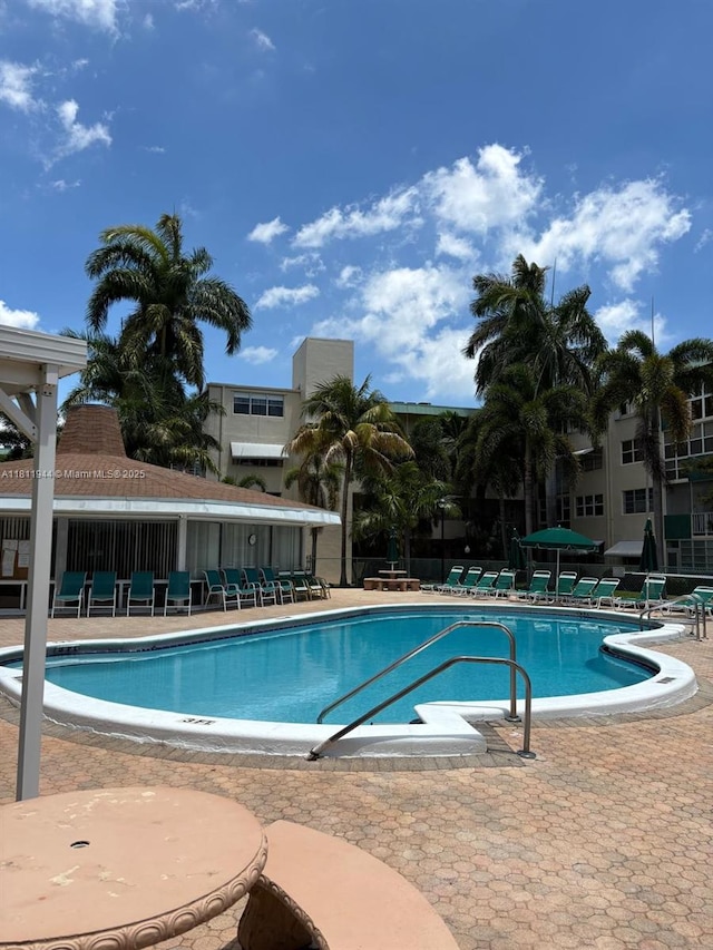 1333 E Hallandale Beach Blvd Unit 134, Hallandale Beach, FL 33009 - community pool with a patio