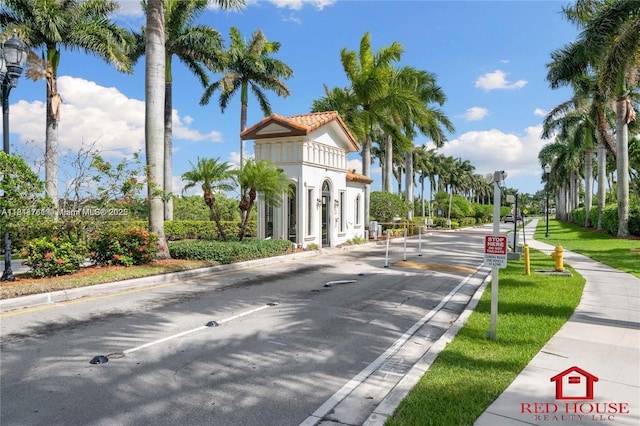 7855 SW 195th Ter, Cutler Bay, FL 33157 - view of asphalt road featuring curbs, sidewalks, traffic signs, and street lighting