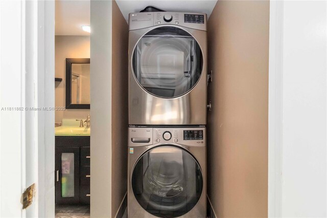 3003 30th Ln, Green Acres, FL 33463 - washroom with stacked washer / drying machine
