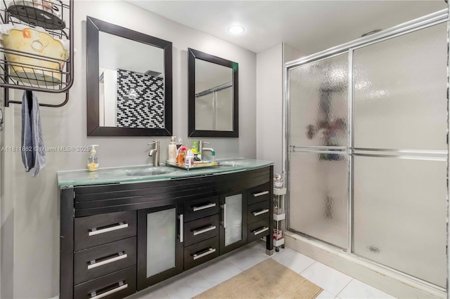 3003 30th Ln, Green Acres, FL 33463 - bathroom with a shower stall, double vanity, and tile patterned flooring