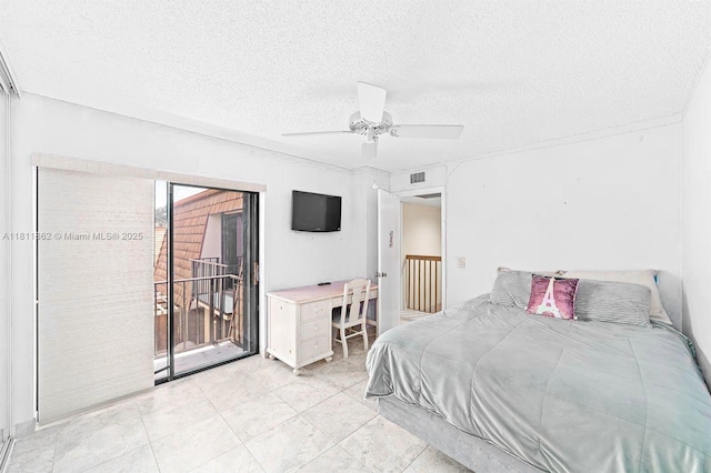 3003 30th Ln, Green Acres, FL 33463 - bedroom with access to outside, a textured ceiling, and ceiling fan