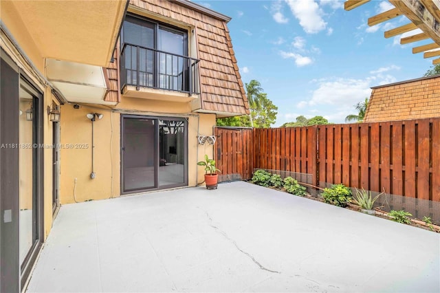 3003 30th Ln, Green Acres, FL 33463 - fenced backyard with a patio