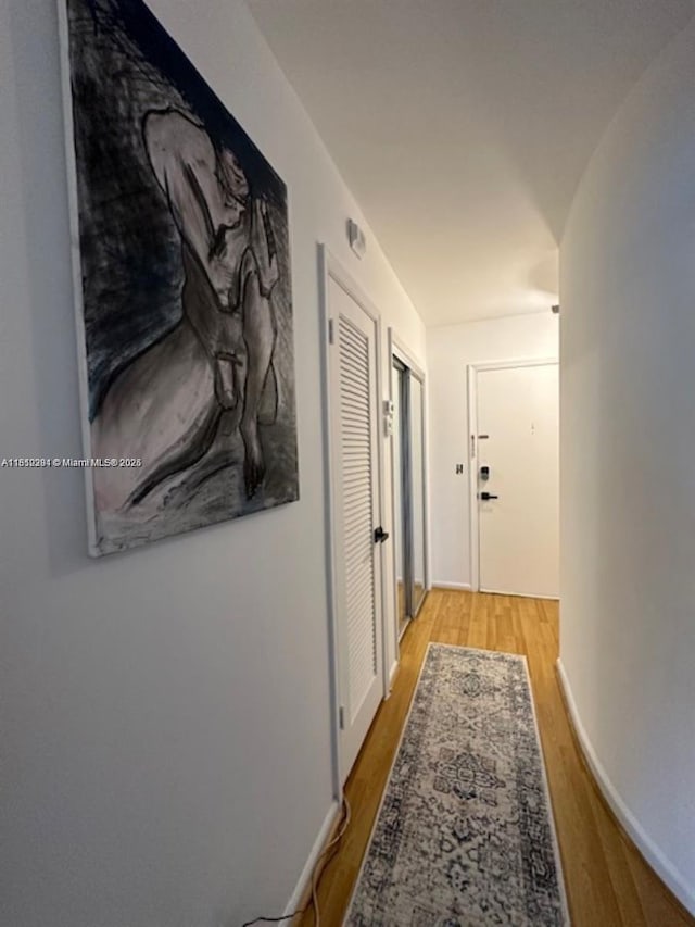 2181 NE 67th St Unit 628, Fort Lauderdale, FL 33308 - hallway featuring wood finished floors