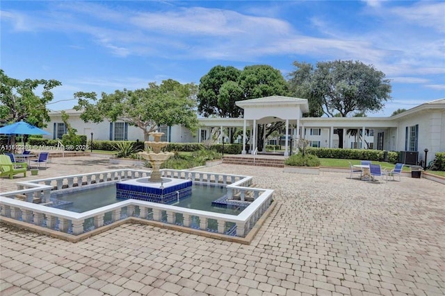 2181 NE 67th St Unit 628, Fort Lauderdale, FL 33308 - view of swimming pool featuring cooling unit