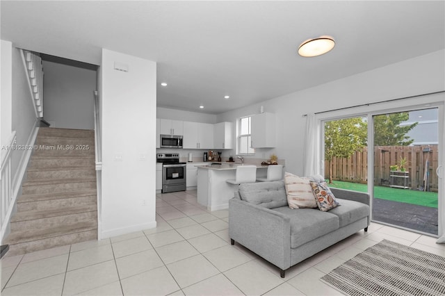 11835 NW 46th St, Coral Springs, FL 33076 - living area featuring stairs, light tile patterned floors, and recessed lighting