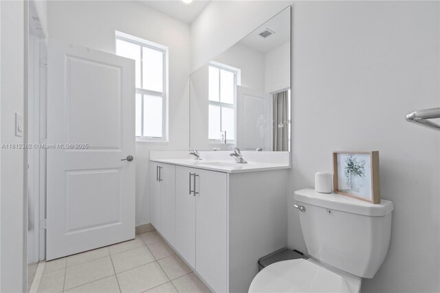 11835 NW 46th St, Coral Springs, FL 33076 - bathroom with toilet, vanity, and tile patterned floors