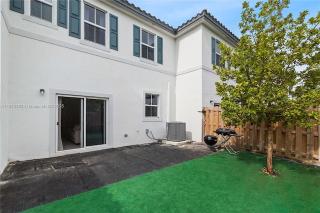 11835 NW 46th St, Coral Springs, FL 33076 - rear view of house with cooling unit, stucco siding, and a tiled roof