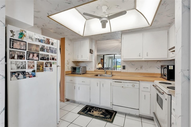 7355 NW 18th St Unit 106, Margate, FL 33063 - kitchen with white appliances, a sink, ceiling fan, light tile patterned flooring, and light countertops
