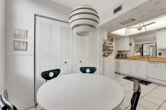7355 NW 18th St Unit 106, Margate, FL 33063 - dining space featuring light tile patterned floors