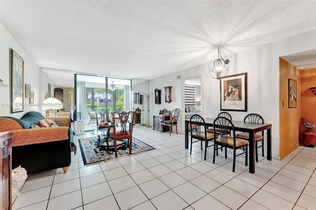 7355 NW 18th St Unit 106, Margate, FL 33063 - dining space with a textured ceiling, a chandelier, light tile patterned floors, and floor to ceiling windows