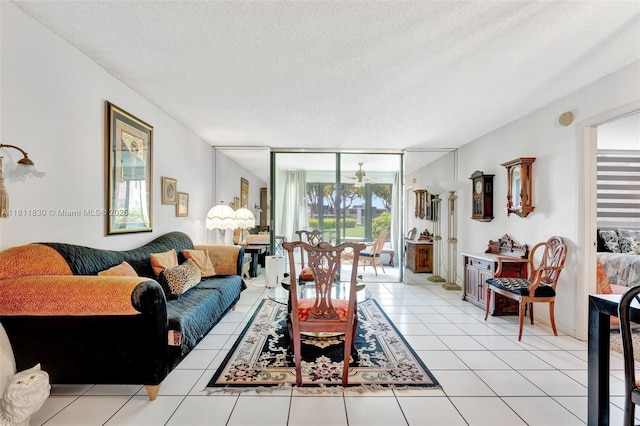 7355 NW 18th St Unit 106, Margate, FL 33063 - living area with healthy amount of natural light, a textured ceiling, light tile patterned floors, and ceiling fan