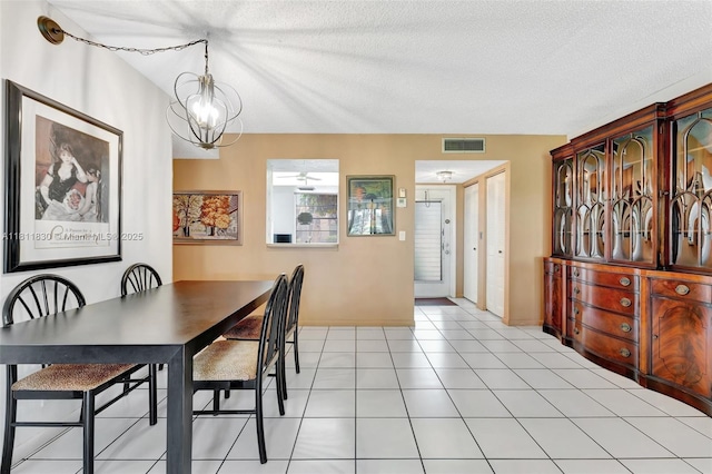 7355 NW 18th St Unit 106, Margate, FL 33063 - dining area with a chandelier, baseboards, and a textured ceiling