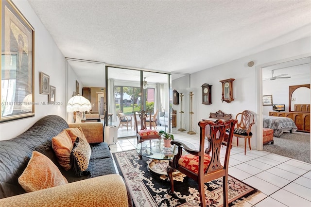 7355 NW 18th St Unit 106, Margate, FL 33063 - living area with light tile patterned flooring, a textured ceiling, and expansive windows