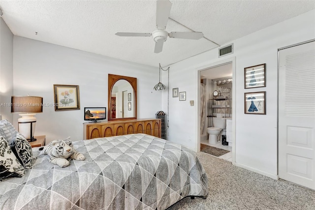 7355 NW 18th St Unit 106, Margate, FL 33063 - carpeted bedroom featuring a textured ceiling, a ceiling fan, and connected bathroom