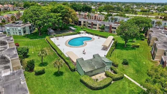 7355 NW 18th St Unit 106, Margate, FL 33063 - aerial view of property and surrounding area featuring a pool area