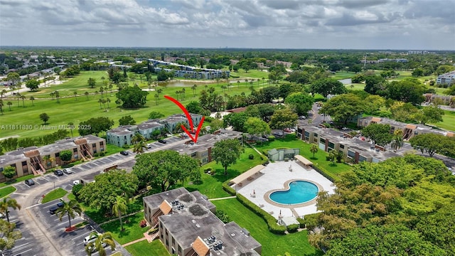 7355 NW 18th St Unit 106, Margate, FL 33063 - drone / aerial view of a pool, a local golf course, and a large body of water
