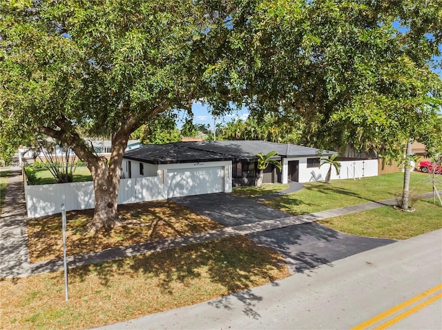 5131 Monroe St, Hollywood, FL 33021 - view of front of house with driveway and an attached garage