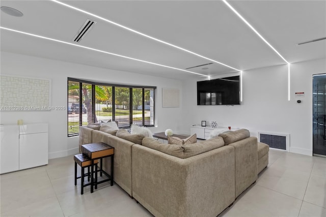 5131 Monroe St, Hollywood, FL 33021 - living room featuring light tile patterned floors and baseboards