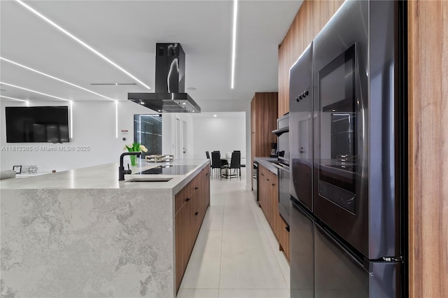 5131 Monroe St, Hollywood, FL 33021 - kitchen featuring modern cabinets, brown cabinetry, island range hood, light tile patterned floors, and a sink
