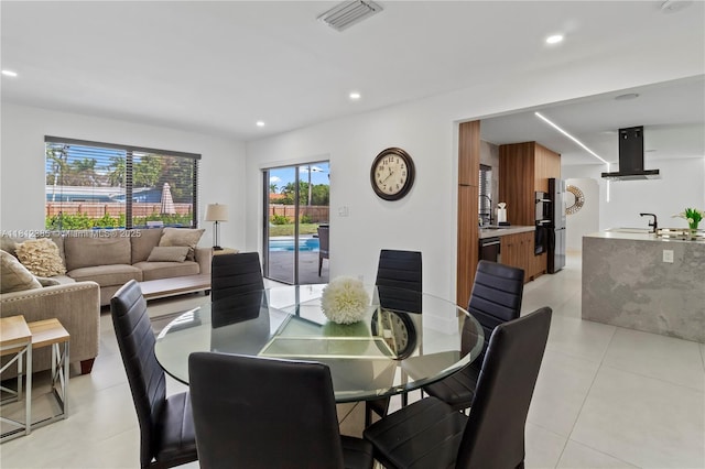 5131 Monroe St, Hollywood, FL 33021 - dining area with light tile patterned floors and recessed lighting