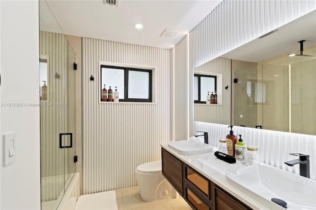 5131 Monroe St, Hollywood, FL 33021 - bathroom with toilet, double vanity, and tile patterned floors
