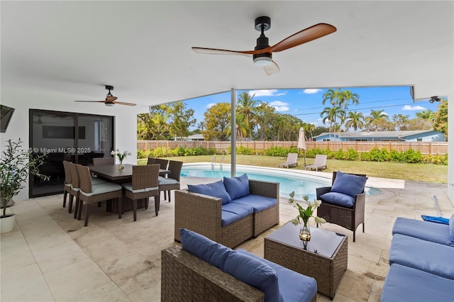 5131 Monroe St, Hollywood, FL 33021 - fenced backyard with ceiling fan, an outdoor hangout area, outdoor dining space, and a patio area