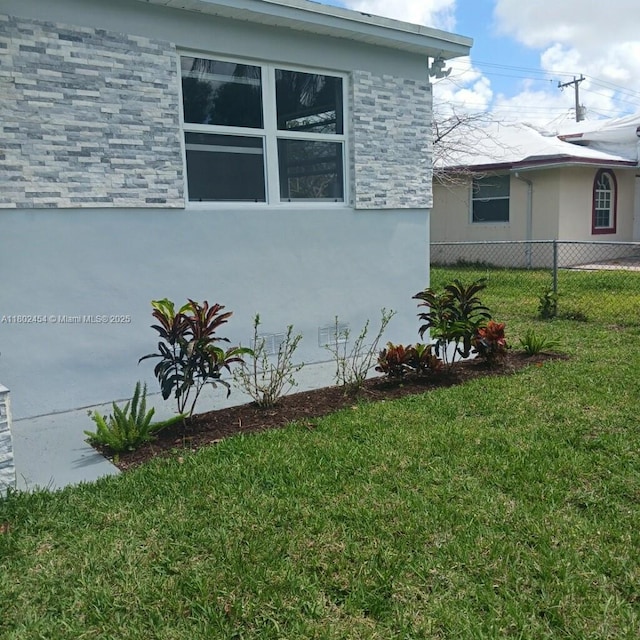 6421 Allen St, Hollywood, FL 33024 - view of property exterior with stucco siding and stone siding