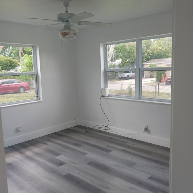 6421 Allen St, Hollywood, FL 33024 - spare room with healthy amount of natural light, ceiling fan, wood finished floors, and baseboards