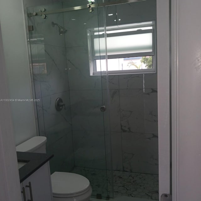 6421 Allen St, Hollywood, FL 33024 - bathroom featuring toilet, vanity, and a marble finish shower