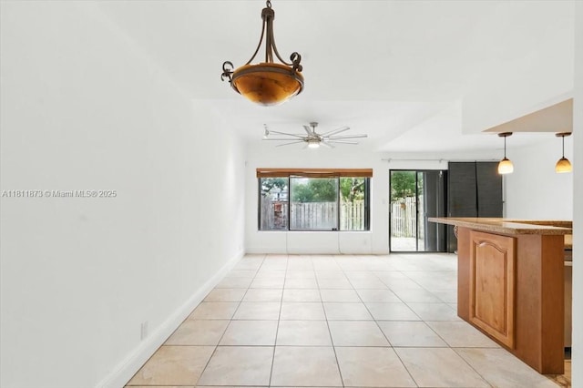 4225 N 76th Ave, Davie, FL 33024 - unfurnished living room featuring light tile patterned floors, ceiling fan, and baseboards