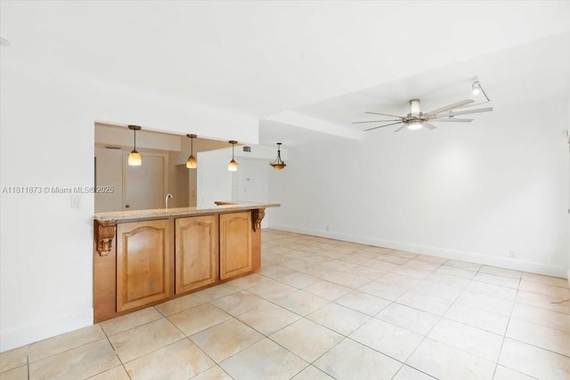 4225 N 76th Ave, Davie, FL 33024 - kitchen with a ceiling fan, baseboards, and light countertops