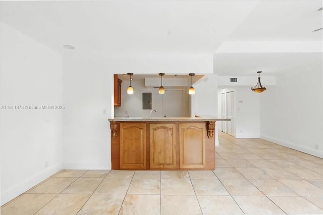 4225 N 76th Ave, Davie, FL 33024 - kitchen with light tile patterned flooring, a peninsula, light countertops, and baseboards