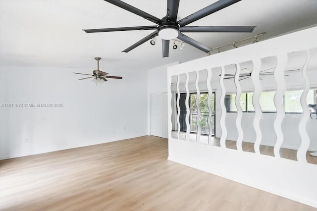4225 N 76th Ave, Davie, FL 33024 - unfurnished living room with ceiling fan and wood finished floors