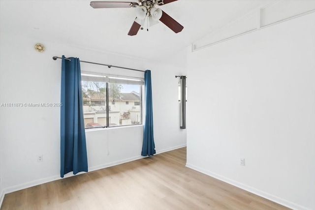 4225 N 76th Ave, Davie, FL 33024 - empty room with wood finished floors, a ceiling fan, and baseboards