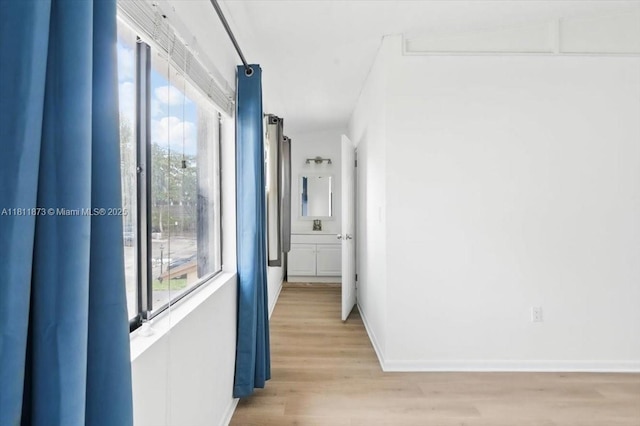 4225 N 76th Ave, Davie, FL 33024 - hall featuring light wood-style flooring and baseboards