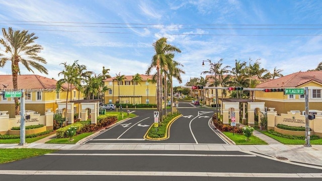 8980 W Flagler St Unit 202, Miami, FL 33174 - view of asphalt road with sidewalks, curbs, traffic signs, and a residential view