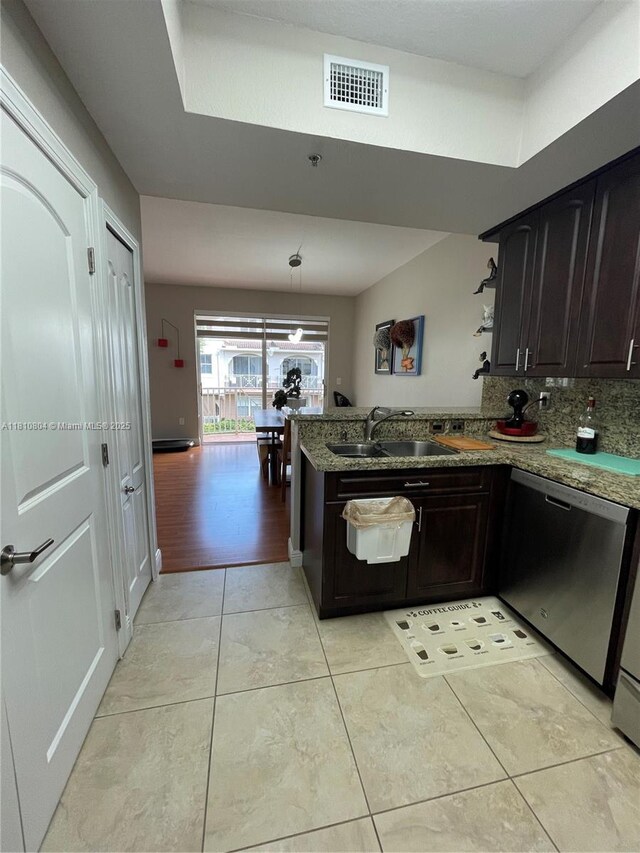 8980 W Flagler St Unit 202, Miami, FL 33174 - kitchen featuring dishwasher, a sink, light stone counters, light tile patterned flooring, and backsplash