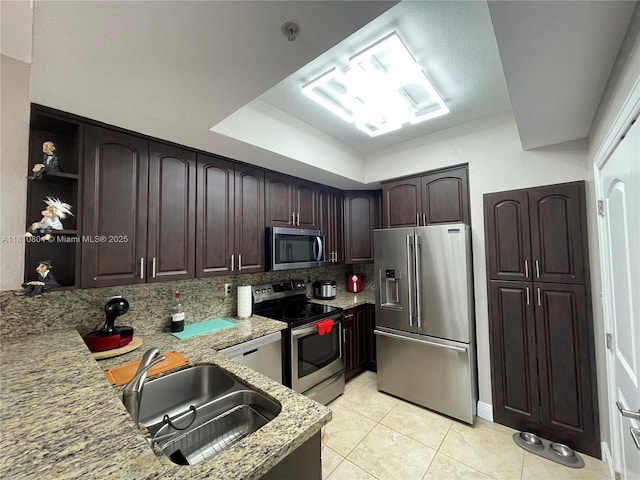 8980 W Flagler St Unit 202, Miami, FL 33174 - kitchen with stainless steel appliances, dark brown cabinetry, light tile patterned floors, and open shelves