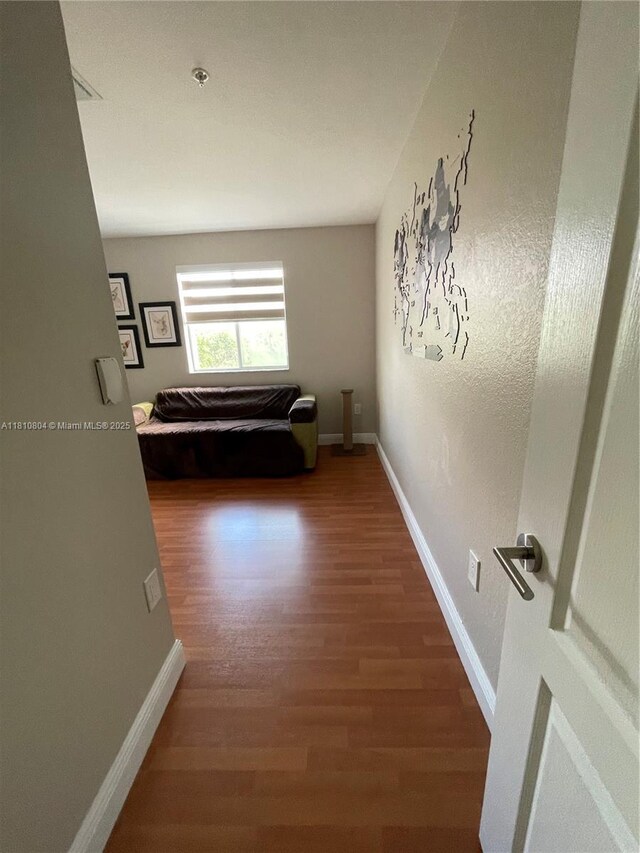 8980 W Flagler St Unit 202, Miami, FL 33174 - hallway featuring wood finished floors and baseboards