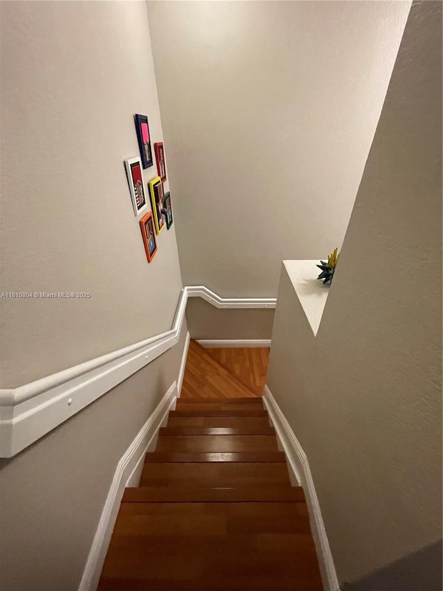 8980 W Flagler St Unit 202, Miami, FL 33174 - stairs with wood finished floors and baseboards