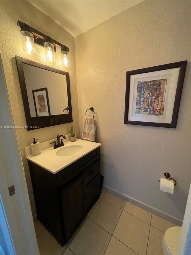 8980 W Flagler St Unit 202, Miami, FL 33174 - half bath with vanity, toilet, tile patterned floors, and baseboards