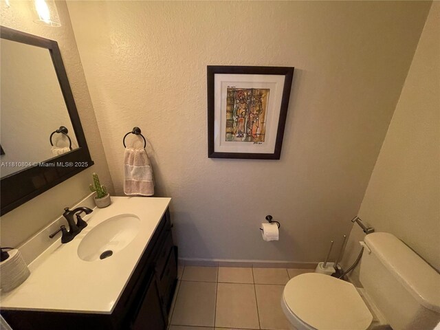 8980 W Flagler St Unit 202, Miami, FL 33174 - half bath featuring vanity, toilet, baseboards, and tile patterned flooring