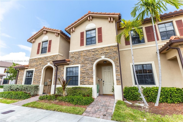 9214 W 33rd Ln, Hialeah, FL 33018 - view of front of property featuring stone siding, stucco siding, and a tile roof