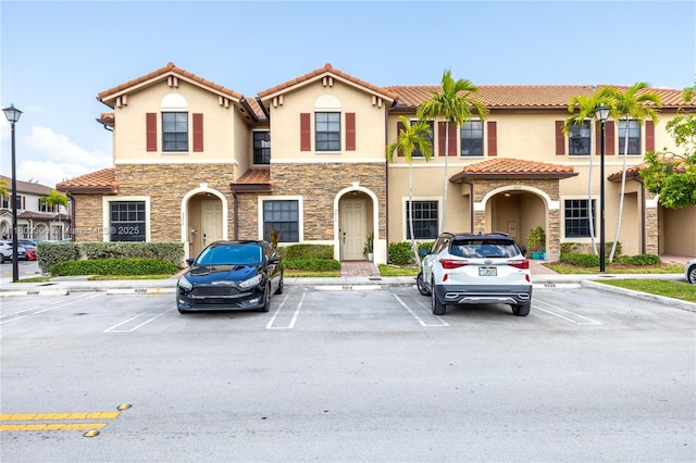 9214 W 33rd Ln, Hialeah, FL 33018 - multi unit property featuring stone siding, stucco siding, and uncovered parking