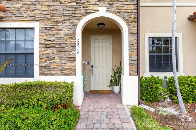9214 W 33rd Ln, Hialeah, FL 33018 - property entrance featuring stone siding and stucco siding