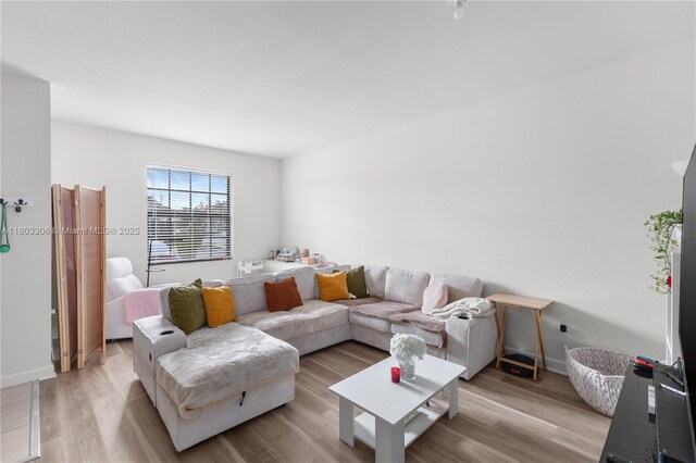 9214 W 33rd Ln, Hialeah, FL 33018 - living area featuring wood finished floors and baseboards