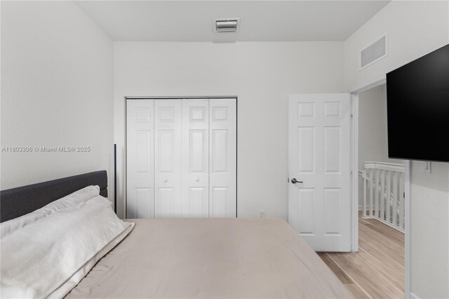 9214 W 33rd Ln, Hialeah, FL 33018 - bedroom featuring wood finished floors and a closet